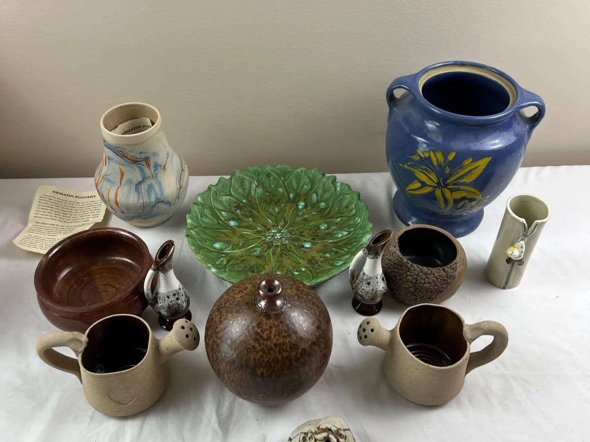 Assorted decorative ceramic vessels and dishes