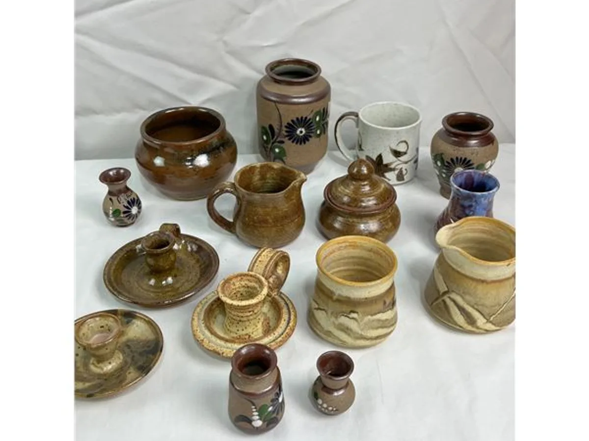 Earth-toned stoneware mugs, jars and pitchers